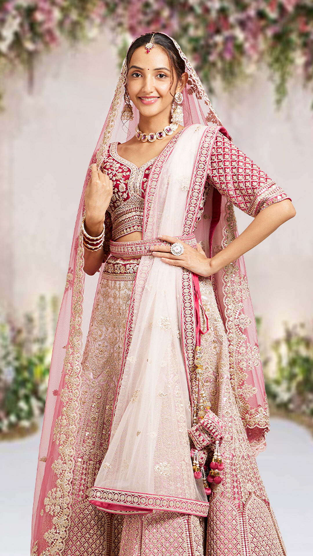 A woman wearing an pink embroidered velvet lehenga